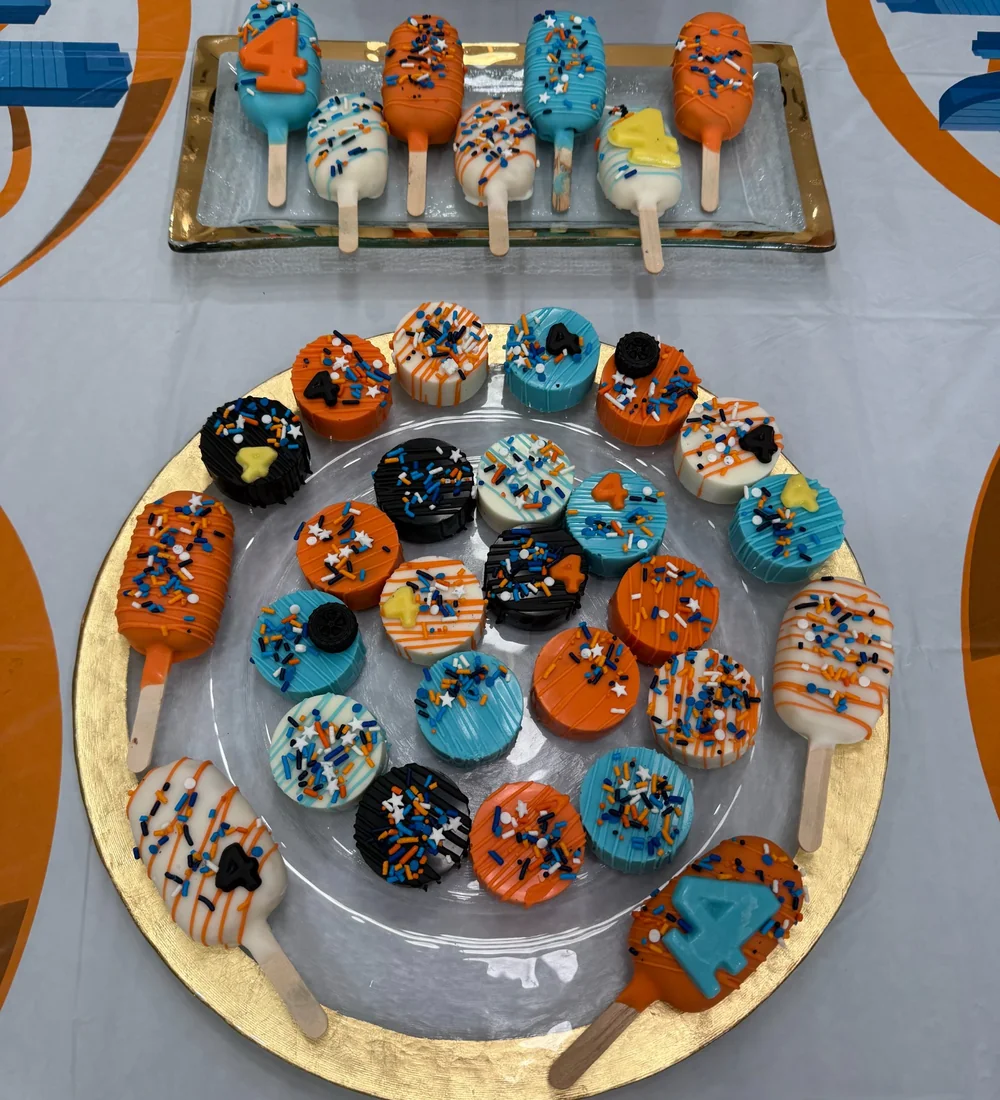 Blue and orange fourth birthday themed dipped treats